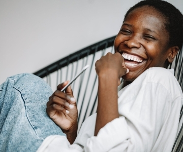 close up photo of a woman laughing