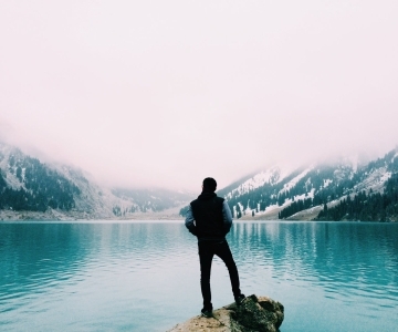person standing near the ocean